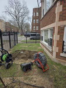 Chicago emergency plumber fixing a burst pipe