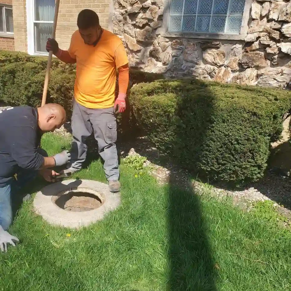 Worker cleaning Sewer Hole